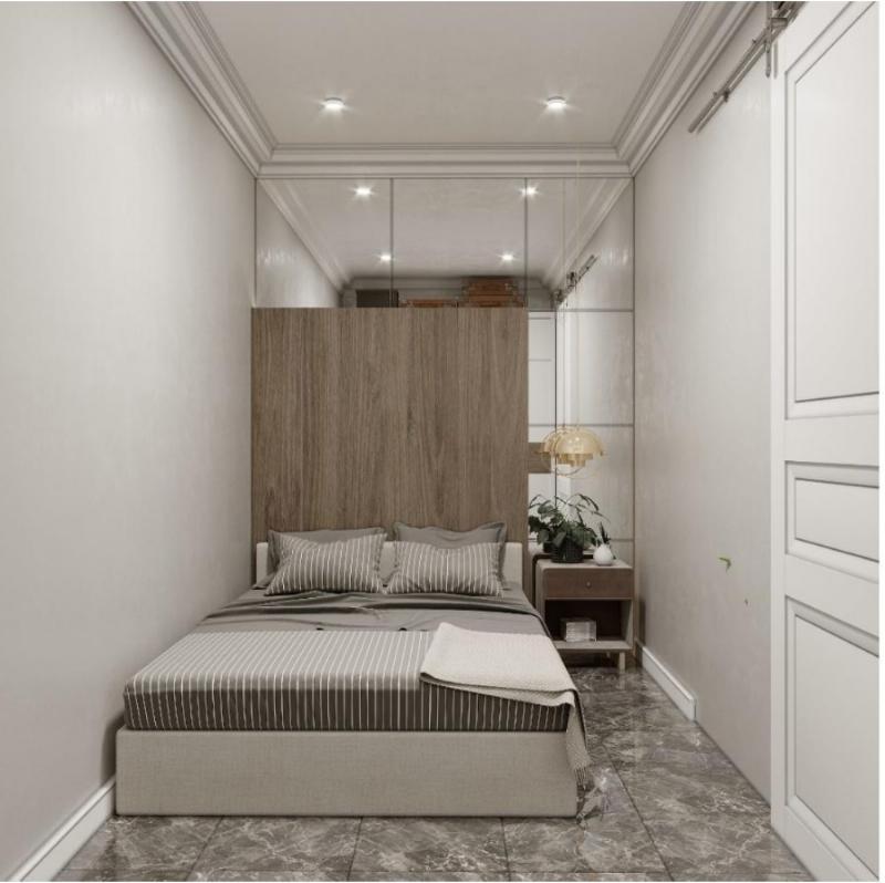 Hình ảnh nội thất đa năng trong phòng trọ có gác lửng, bao gồm một chiếc ghế sofa có thể kéo thành giường và một bàn làm việc gấp gọn gắn tường, tối ưu hóa diện tích sử dụng.